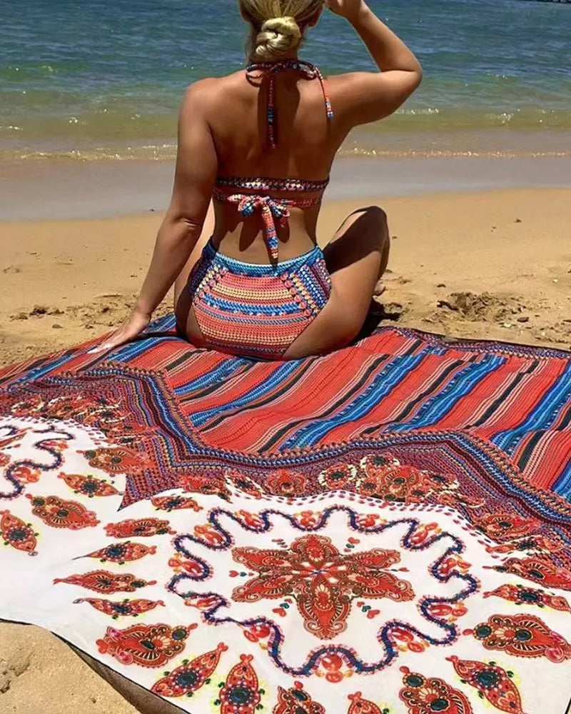 Women's three-piece swimsuit set with cutout sleeveless top, high-waisted briefs, and matching coat on a model.