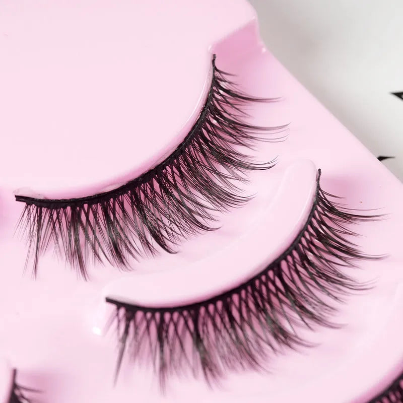 Pack of manga-style false eyelashes showing natural wispy lashes on a black plastic band.