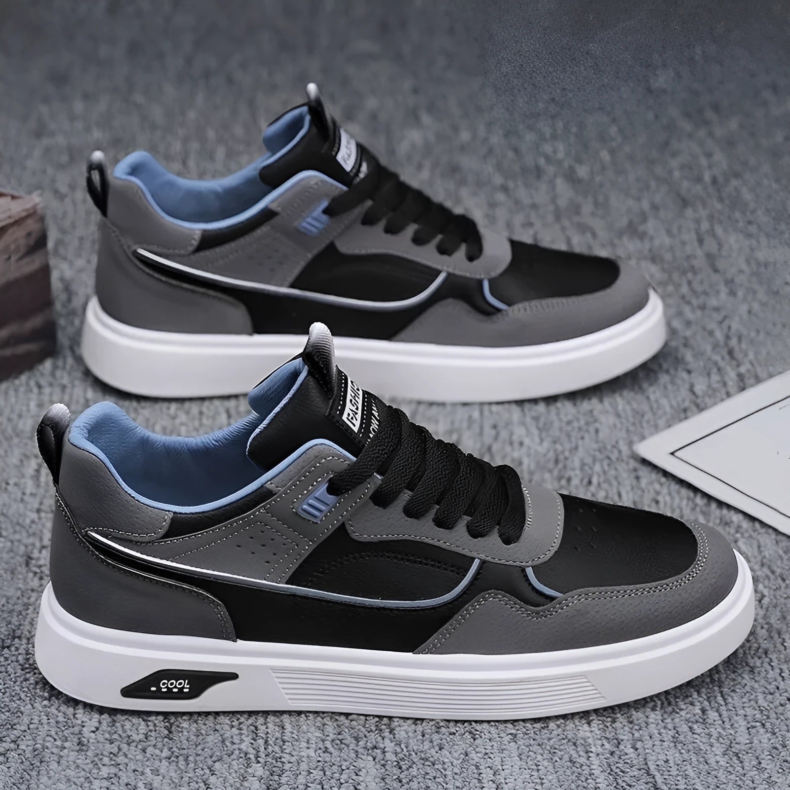 Men's low-top canvas board shoes in solid colours with leather stitching and mesh lining.