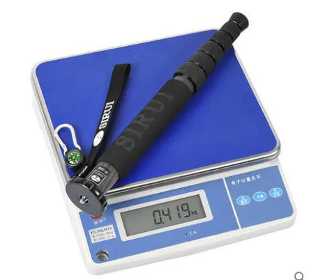Black carbon fibre camera monopod extended to maximum 1540mm height with SLR camera mounted