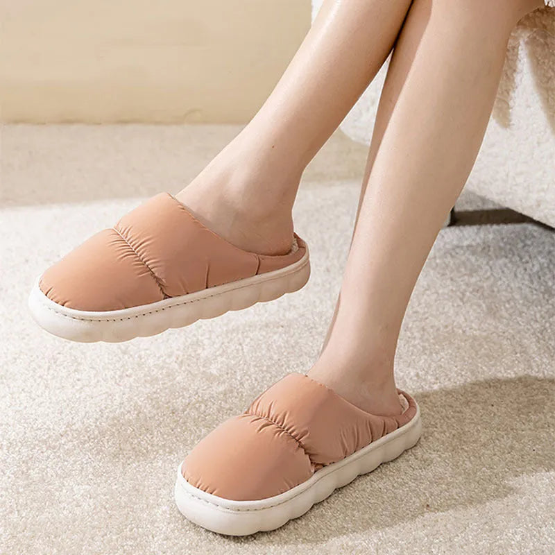 Pair of down cotton winter slippers with a thick rubber non-slip sole, shown in a choice of colours.