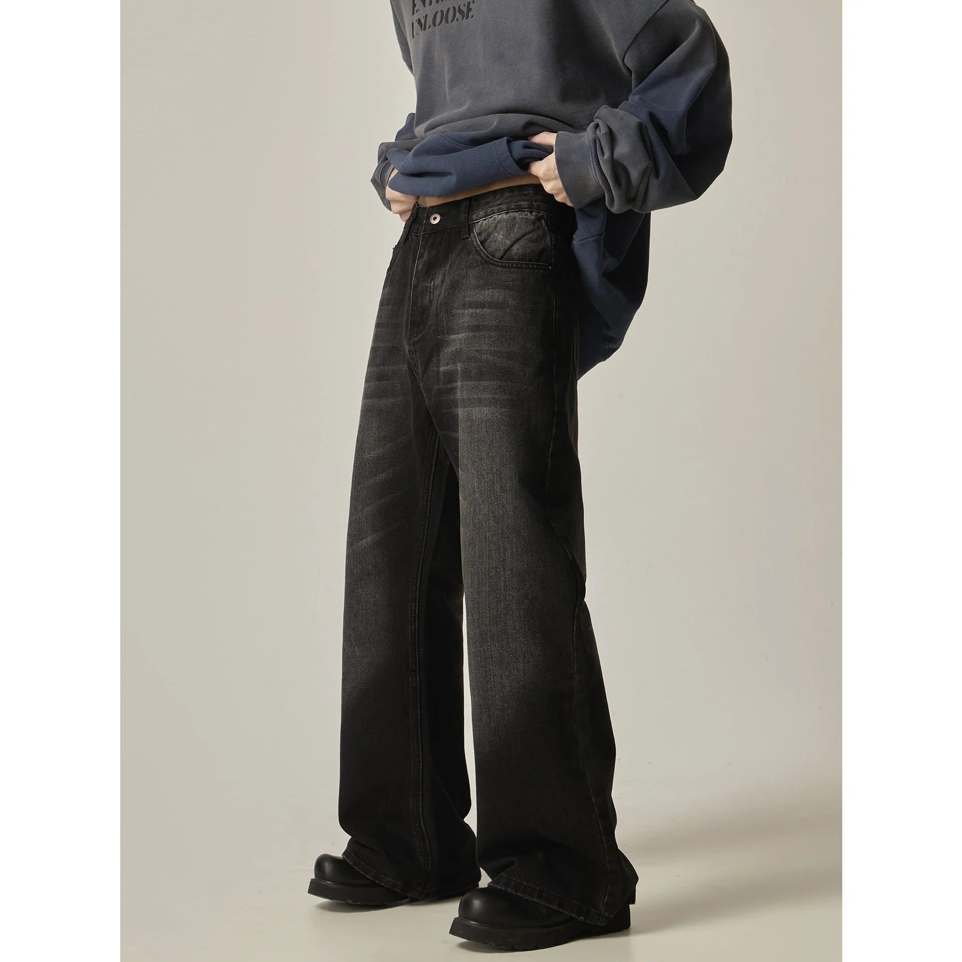 American retro black loose straight-leg jeans with zipper fly on mannequin