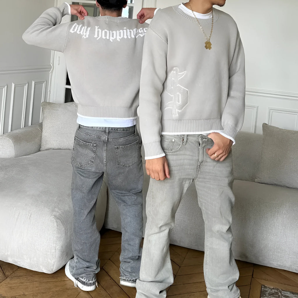 Grey jacquard loose-fitting knitwear coat with long sleeves on hanger