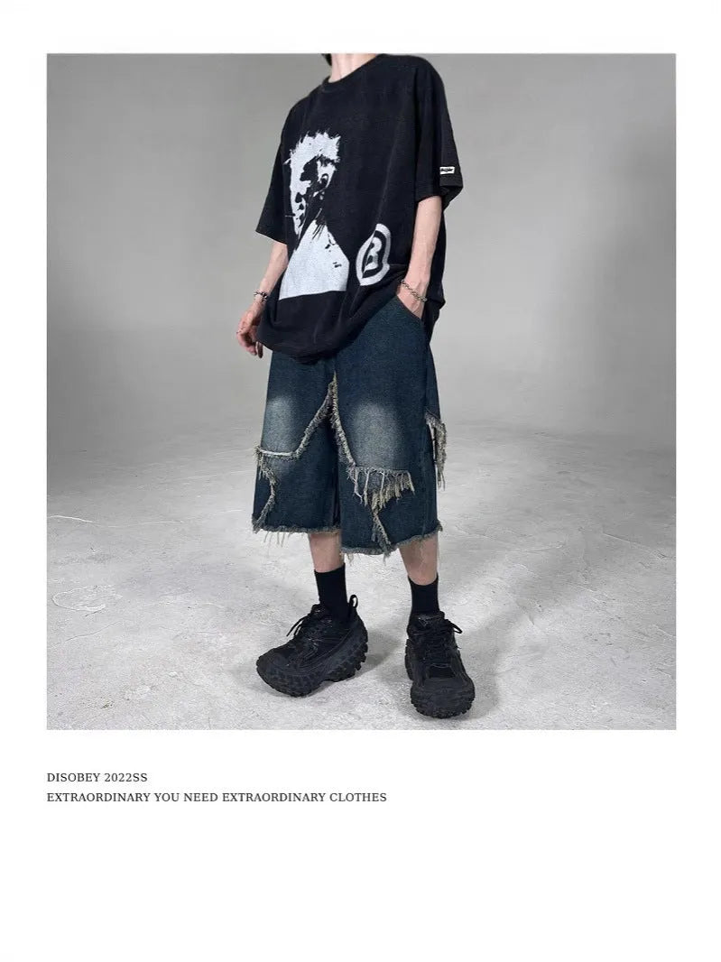 Men's blue denim shorts with loose retro fit, frayed details, and five-pointed star motif on micro-elastic cotton fabric