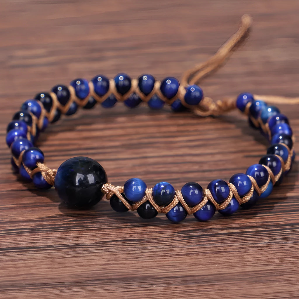 Handmade woven geometric bracelet with blue Tigereye beads and an adjustable pull fastening.