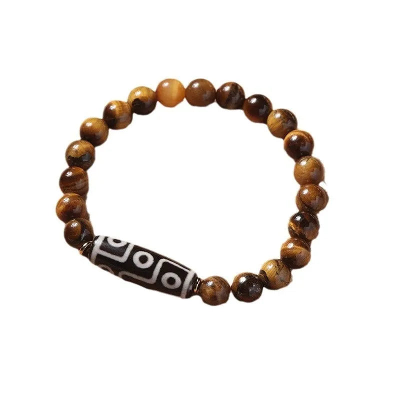 Ethnic style tigereye Dzi bead simplicity Buddha rosary bracelet on display with multiple bead sizes
