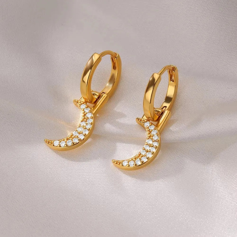 Geometric butterfly-shaped copper earrings for women with heart and star design details.