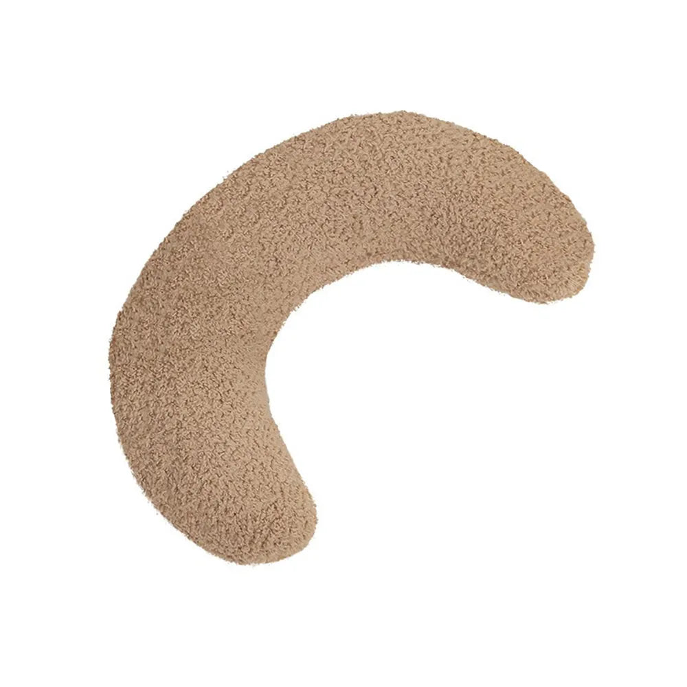 Blue U-shaped cat pillow with adjustable neck collar on sofa