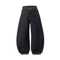 Men's wide leg cotton denim trousers in original cow colour, shown laid flat.