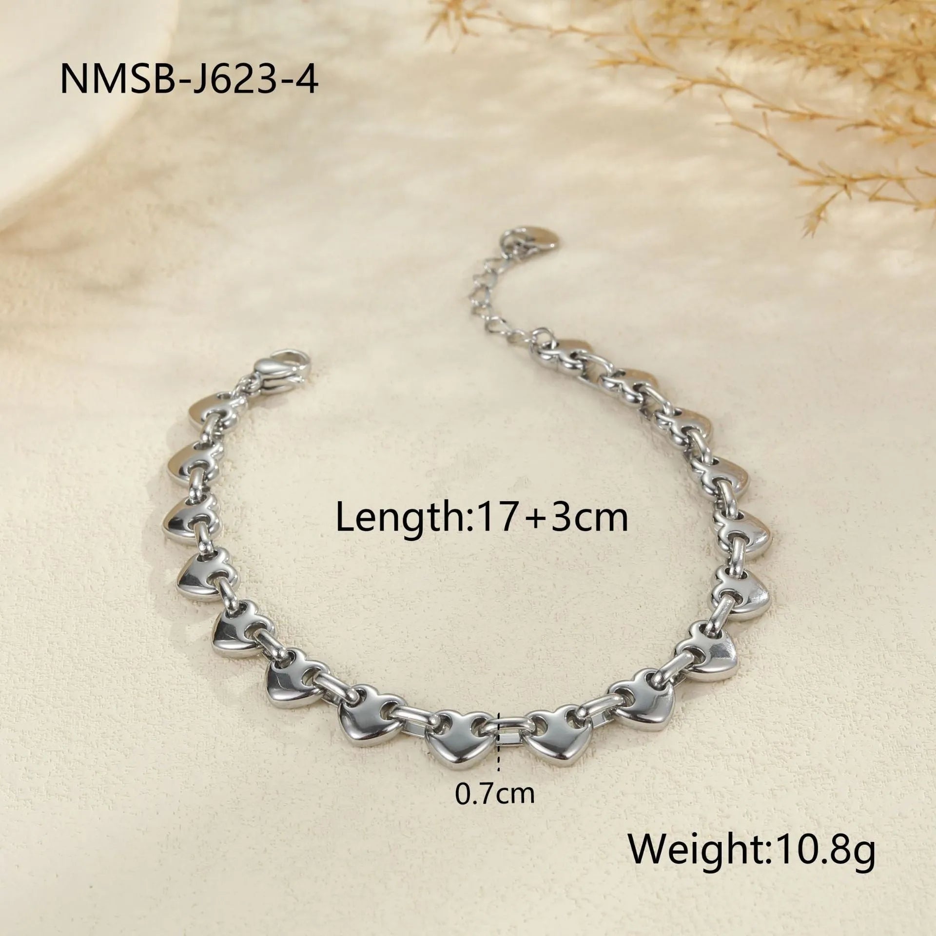 Stainless steel bracelet with hollowed-out heart design in gold electroplated finish for women