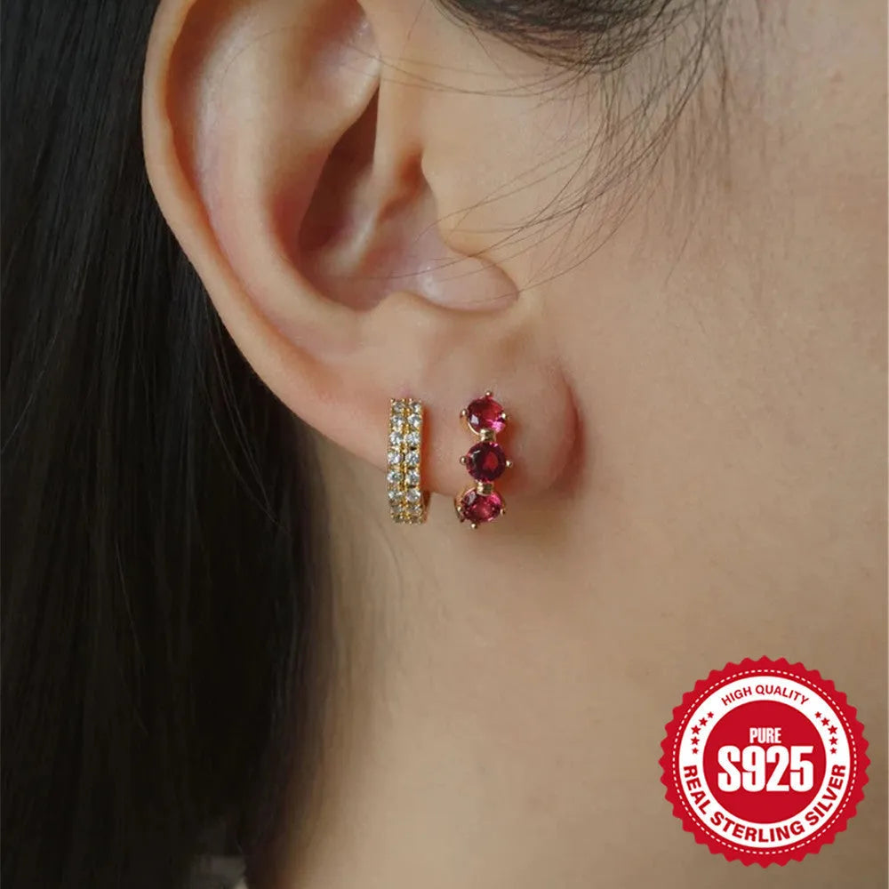 S925 sterling silver earrings with a geometric sunflower design and inlaid zircon stones in a golden colour.