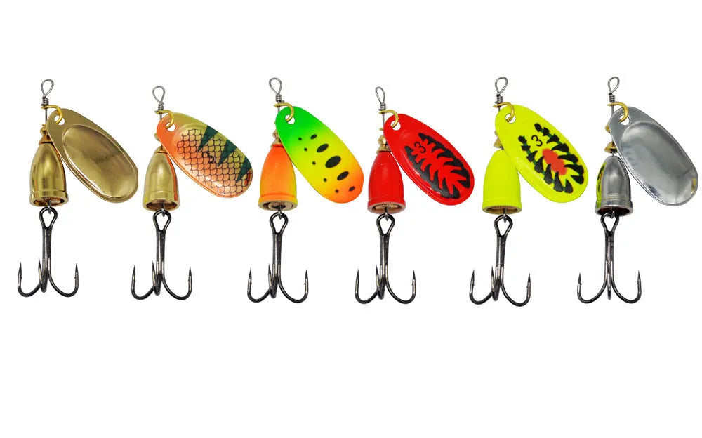 R-shaped metal fishing lure with rotating sequins and a central copper bell in multiple colour options.