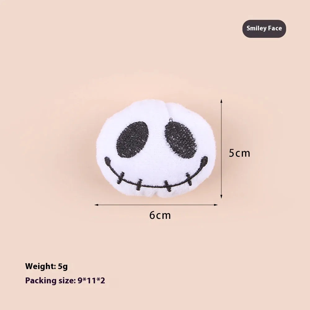 Plush cat teaser wand toy with colourful candy and skull designs on small attachment