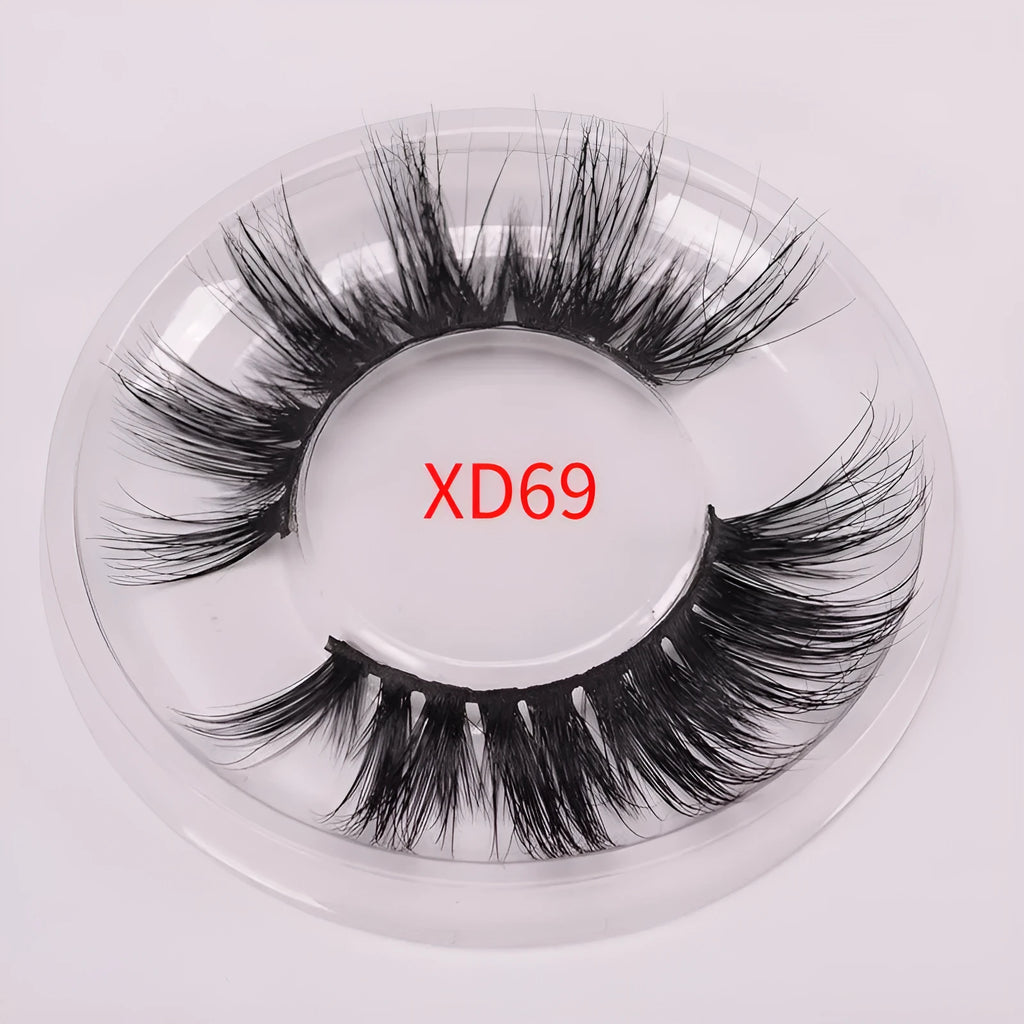 5D mink hair false eyelashes set with applicator brush and storage cap on white background