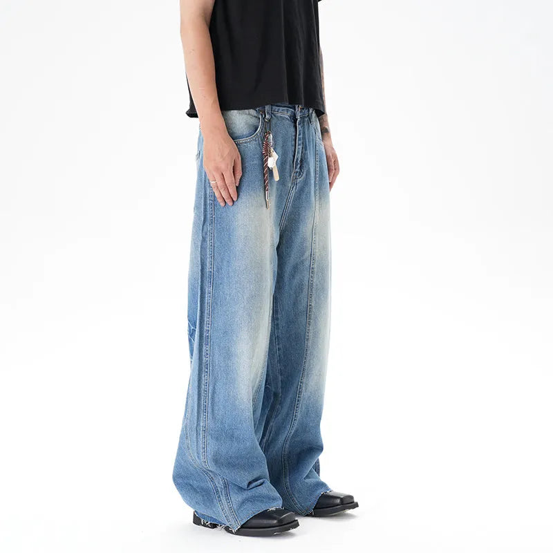 Light blue vintage washed wide leg machete jeans with zip fly on a model