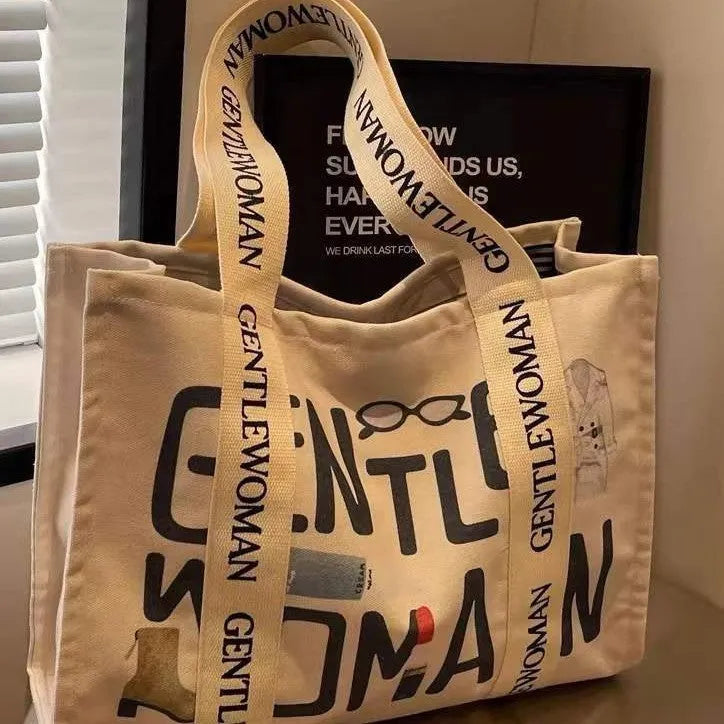 Canvas women's travel tote shopping bag with printed design in unisex style
