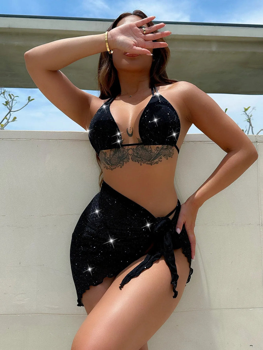 Black three-piece bikini swimsuit set with separate top and shorts