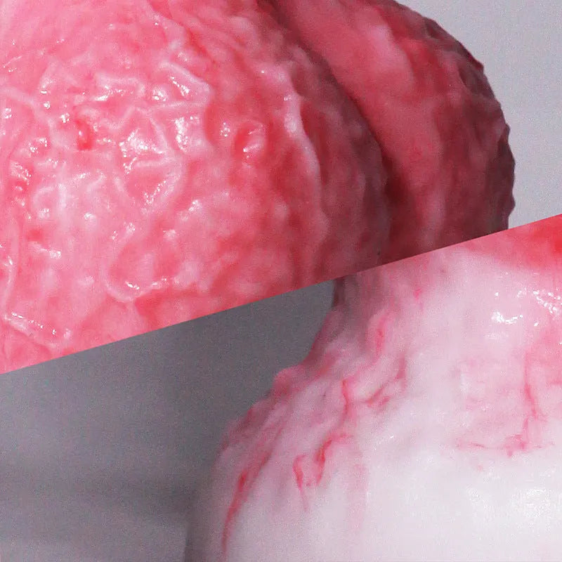 Pink platinum silicone penis-shaped women's masturbator sex toy on a plain background.