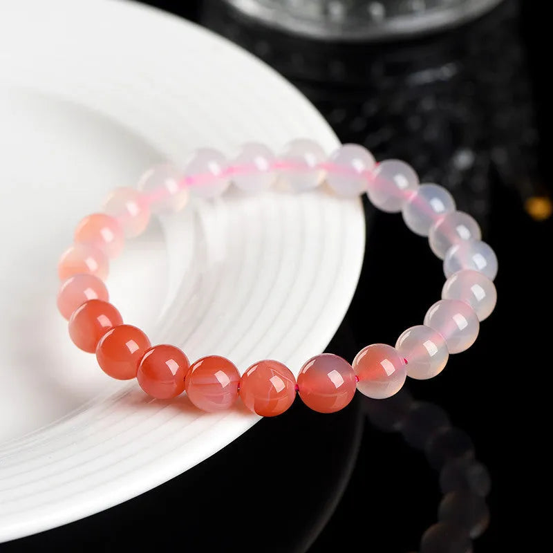 Natural gradient Yanyuan agate bracelet in geometric single-circle design on a neutral background.