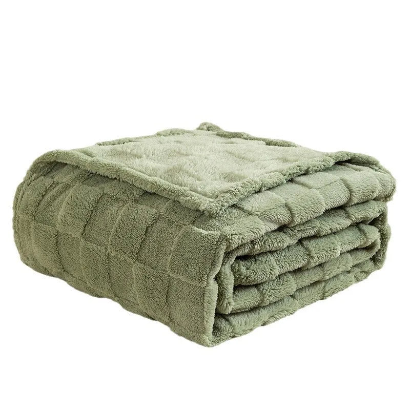 Thickened polyester blanket with geometric pattern in creamy white on a sofa