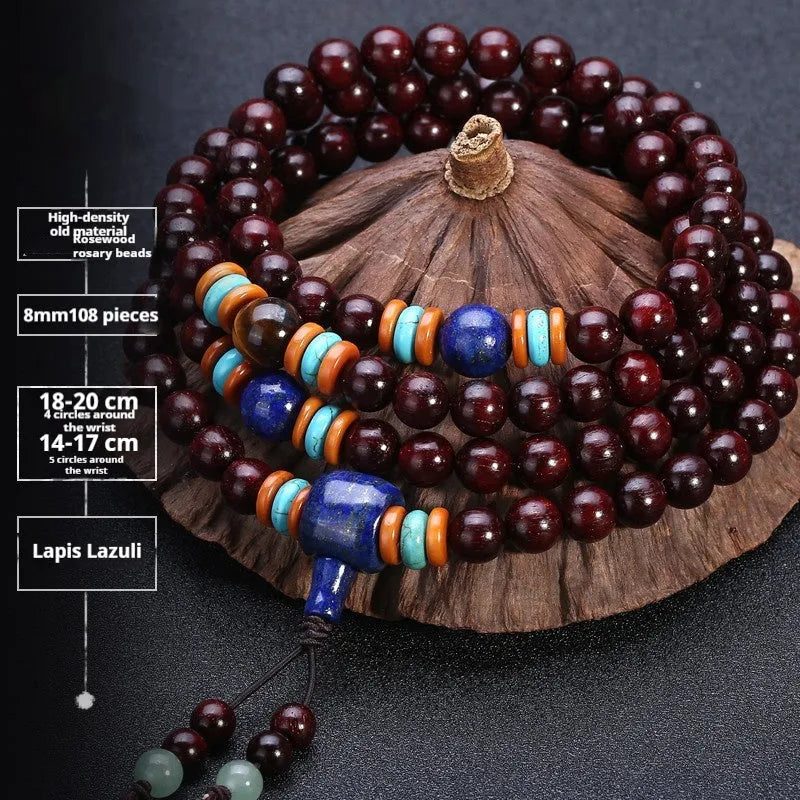 Man's brown wooden mala bracelet with 108 beads including blue lapis lazuli and red agate stones.