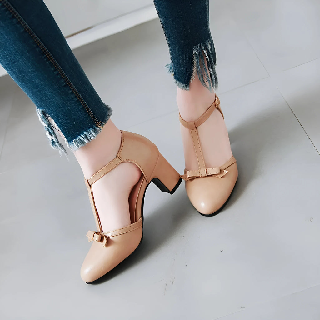 Women's solid-colour chunky heel sandals with buckle strap, round toe, hollow-out design, and a bow.