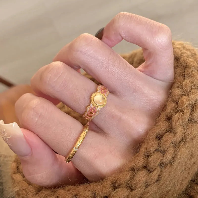 Women's open mouth ring with geometric shape, gold plating, and pink crystal enamel accents