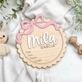 Custom wooden square ornament with a personalised baby name for nursery decoration.