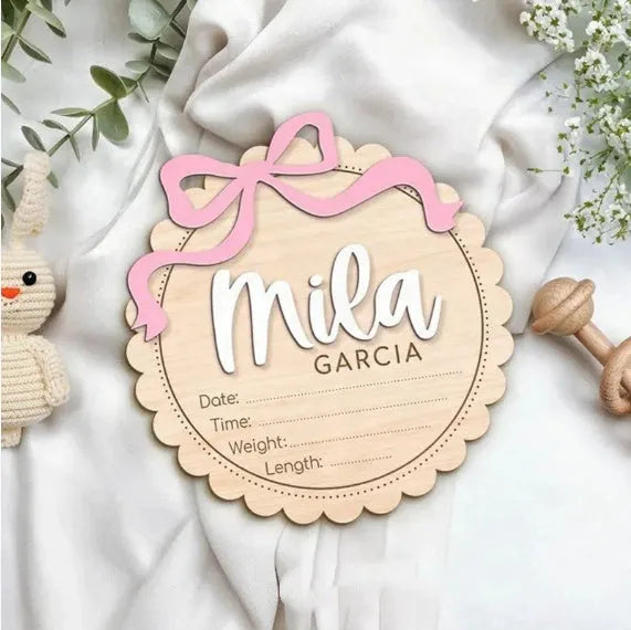 Custom wooden square ornament with a personalised baby name for nursery decoration.