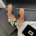 Silver bow rhinestone pointed transparent slip-on high heel sandals with 6-8cm heel and rubber outsole