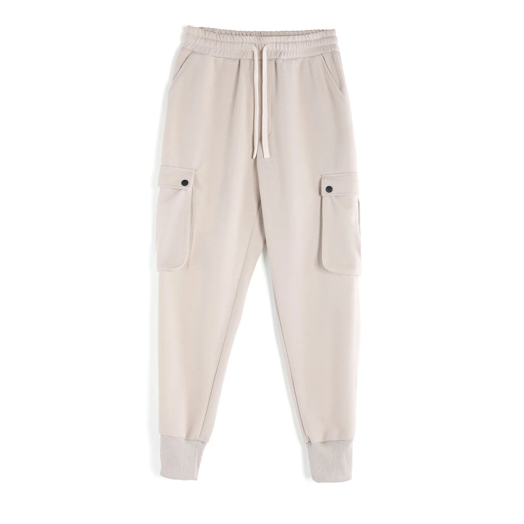 Men's loose cotton sports trousers with ankle tie detail and multiple pockets in apricot colour