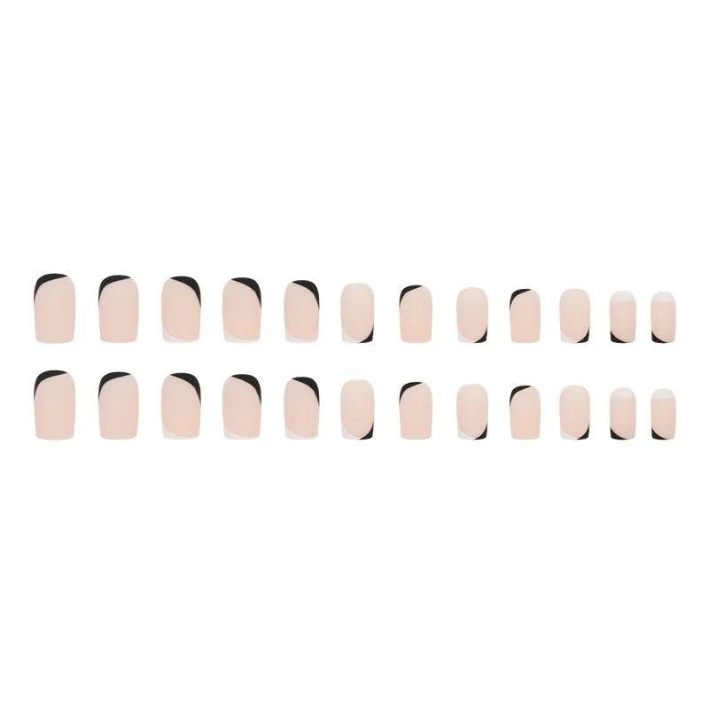 Black and white frosted gel manicure set with plastic nail armour pieces.
