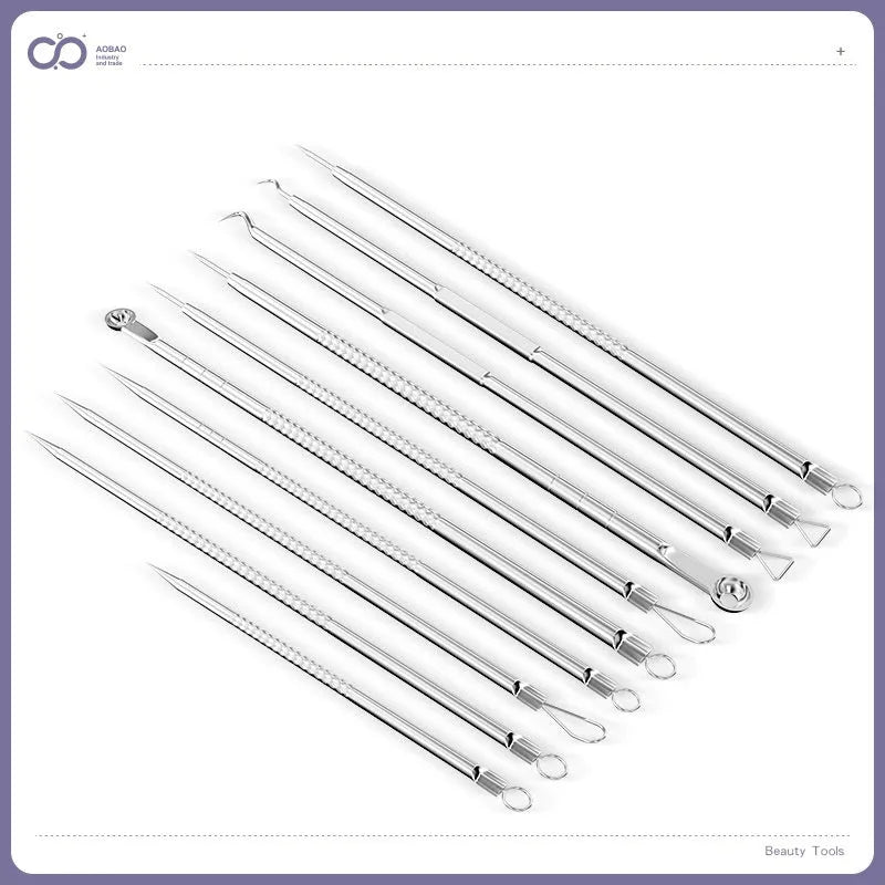 Four silver metal acne needles with fine pointed tips laid out on a surface.