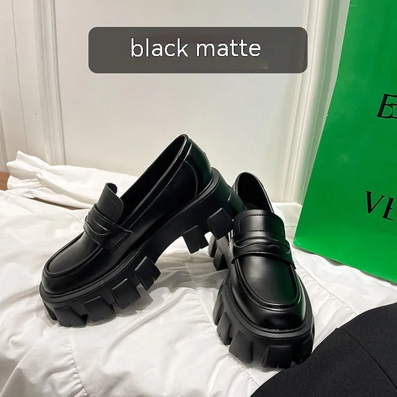 British style men's wide fit loafers in patent leather with a rubber sole.