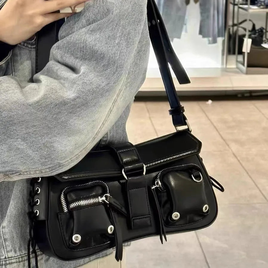 Black PU leather women's baguette messenger bag with adjustable strap and zippered internal compartment.