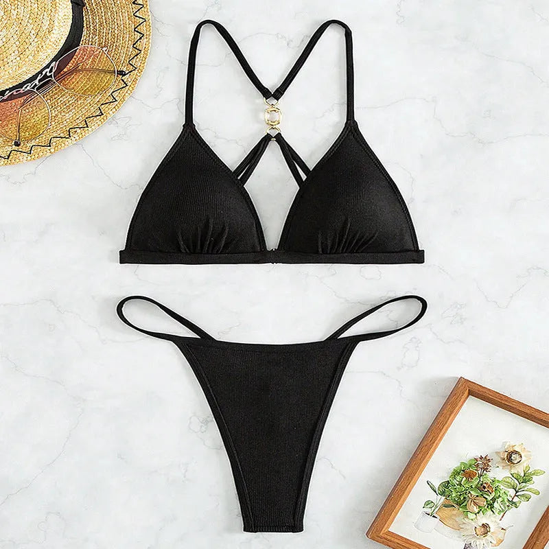 Black women's hollow backless bikini set with triangle top and tie-side bottoms.