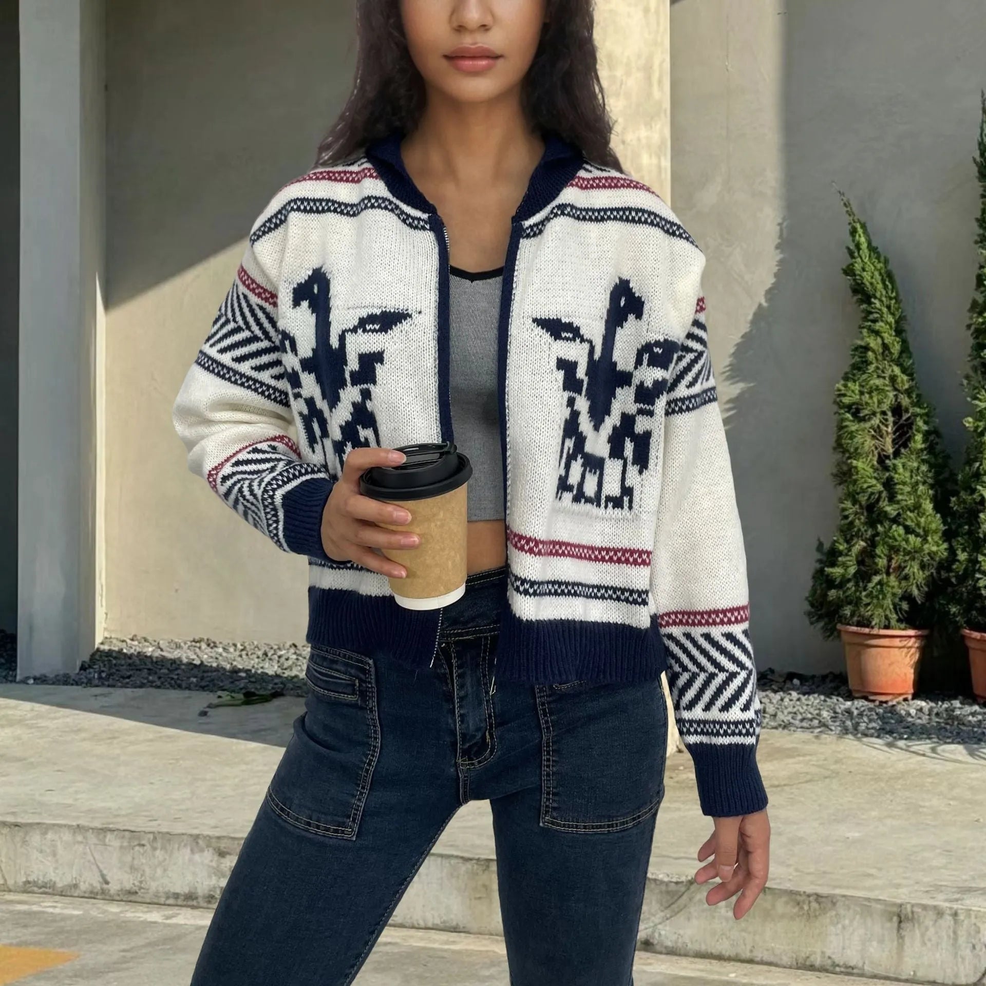 White women's wool zip cardigan with a jacquard contrast colour pattern on the lapel.