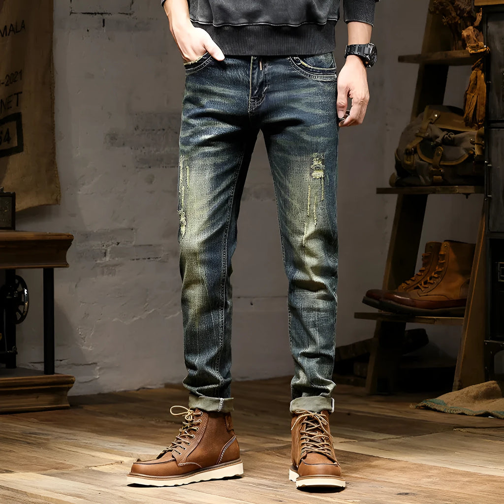 Men's skinny fit jeans in retro colour showing zip fly and tapered leg.
