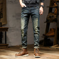 Men's skinny fit jeans in retro colour showing zip fly and tapered leg.