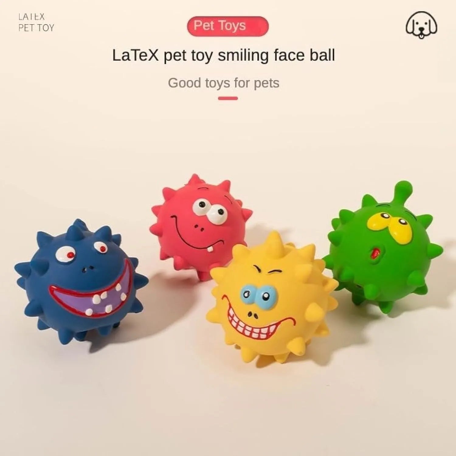Set of four colourful latex squeaky dog balls with cute faces and textured surfaces.