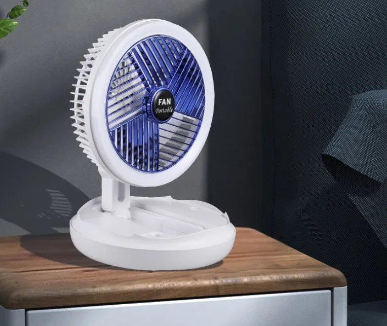 USB charging foldable table fan with LED light and 300-degree rotation on a desk