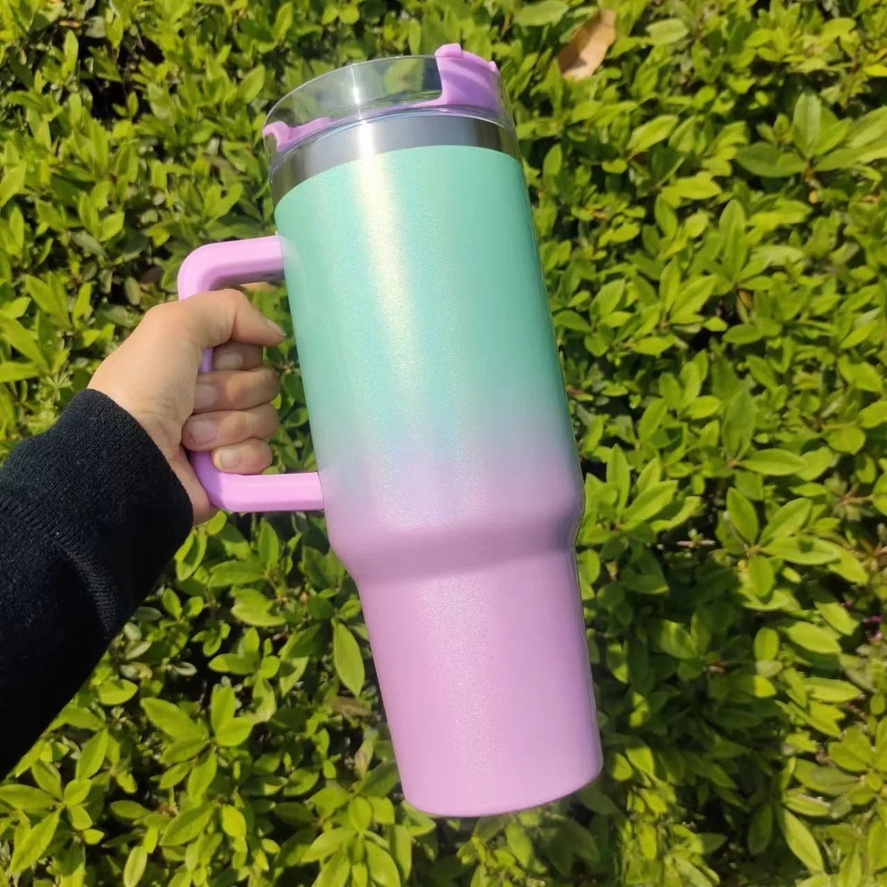 Large stainless steel vacuum insulation cup with gradient colour finish showing 1-litre capacity