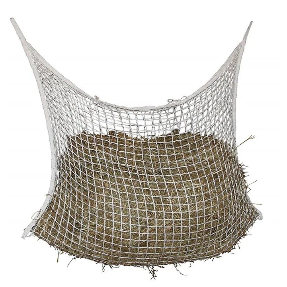 Woven PE rope horse feeding bag with grid pattern in black colour, shown hanging with hay