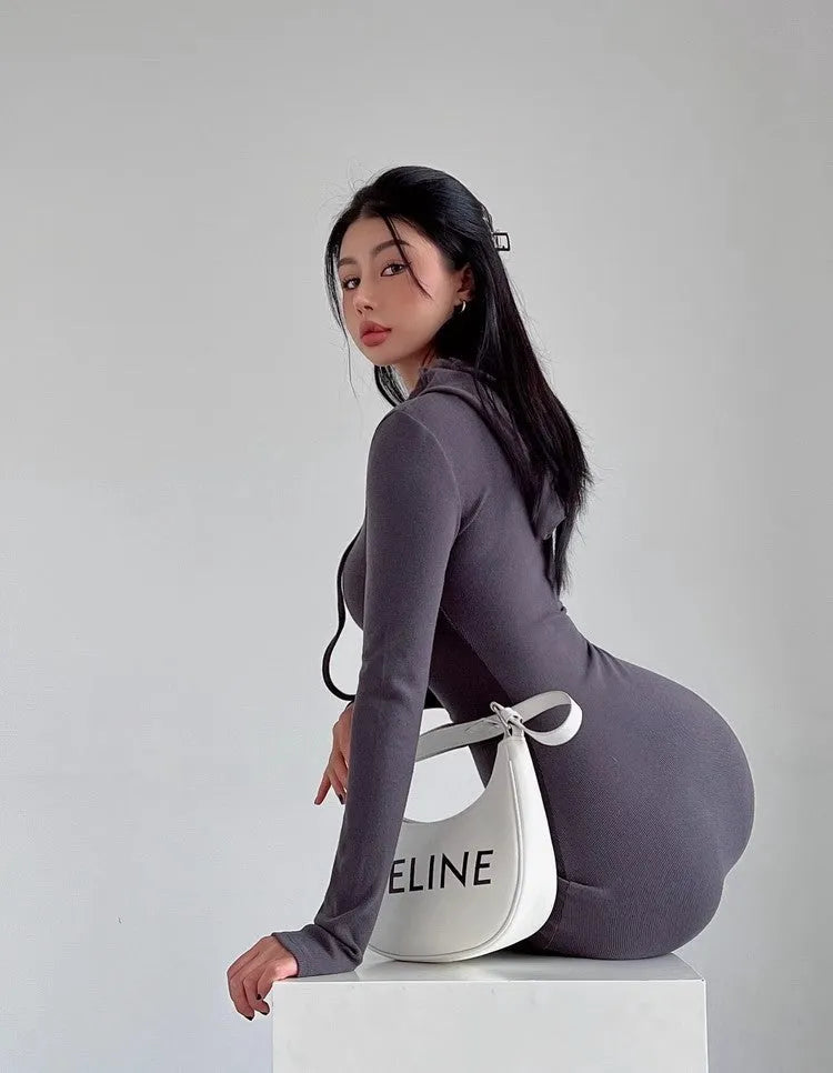Women's grey hooded long-sleeve sheath dress with a high waist on a model.