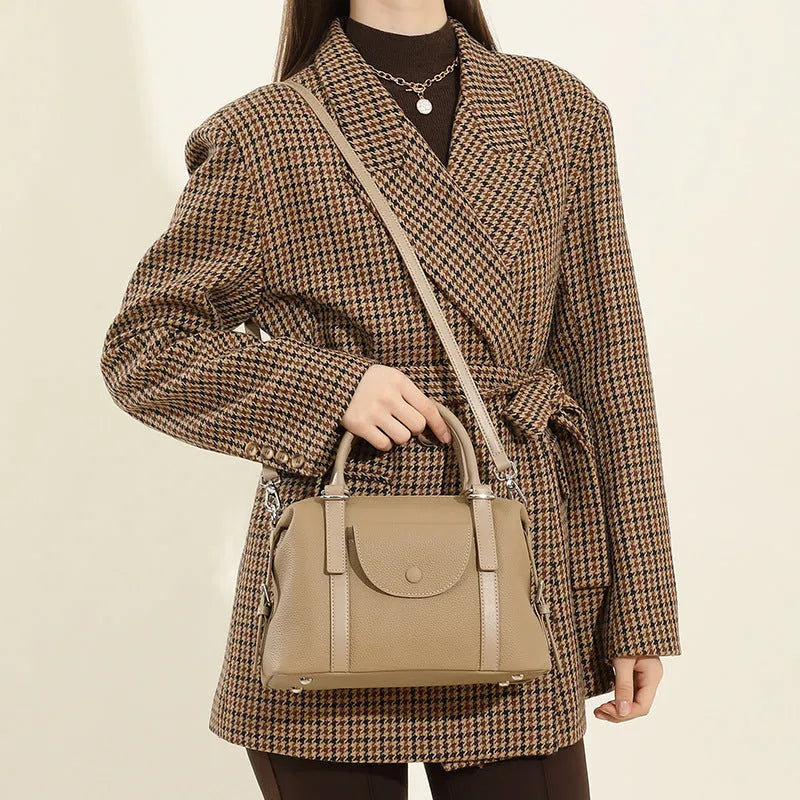 Genuine leather ladies handbag in street trend style with stitching and lock detail