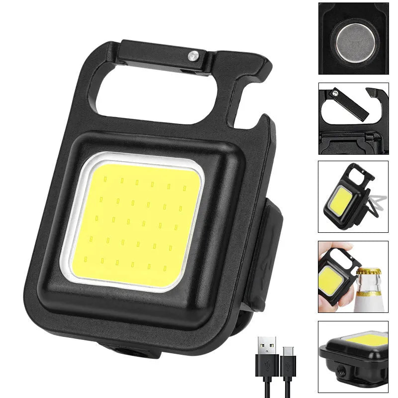 Black aluminium alloy keychain light with COB LED, magnetic base, and foldable handle on keyring