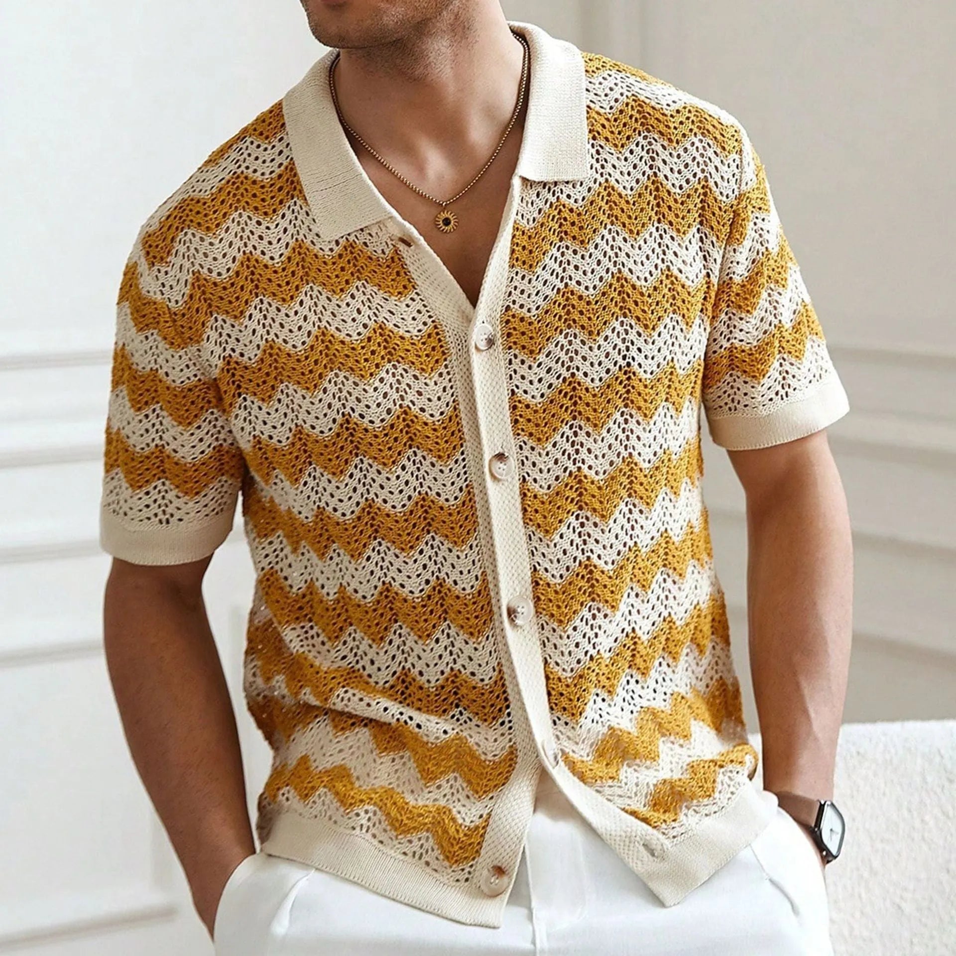 Yellow, blue, and brown short-sleeve sweater with hollow jacquard corrugated texture and flocking detail.
