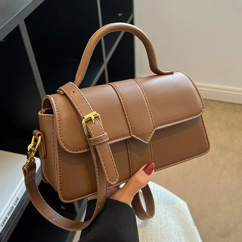 Women's beige messenger bag with horizontal square design showing external pockets and 22cm width