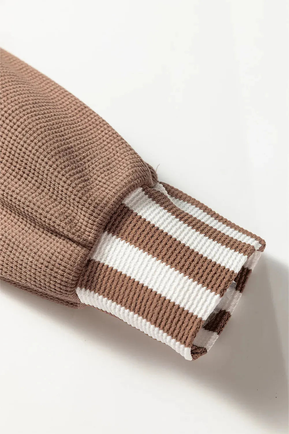 Straw yellow long sleeve hoodie with waffle texture, striped patchwork, button neck, and drawstring hood.