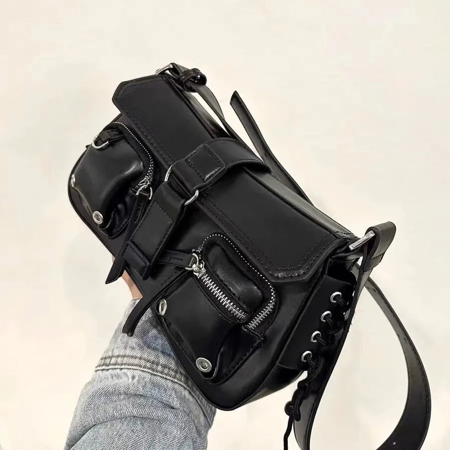 Black PU leather women's baguette messenger bag with adjustable strap and zippered internal compartment.